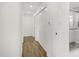 View of bright hallway leading to bathroom with glass shower at 2704 Dove Ln, Raleigh, NC 27604
