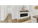 Hallway leading to dining room with modern fireplace at 2704 Dove Ln, Raleigh, NC 27604