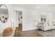 Bright living room featuring hardwood floors, white walls, and stylish decor at 2704 Dove Ln, Raleigh, NC 27604