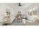 Open-concept living room and dining area with hardwood floors and white walls at 2704 Dove Ln, Raleigh, NC 27604