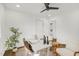 Office space features white walls, wood floors, ceiling fan, desk, and closet at 2704 Dove Ln, Raleigh, NC 27604