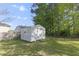 Exterior view of a storage shed in the backyard, ideal for storing tools and equipment at 2704 Dove Ln, Raleigh, NC 27604