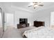 Spacious main bedroom with a large bed, dresser, tv, and an ensuite bathroom at 2749 Nettles Ridge Way, Fuquay Varina, NC 27526