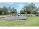 Community playground features a swing set, tunnel, and slide in a grassy area for children to enjoy at 2749 Nettles Ridge Way, Fuquay Varina, NC 27526