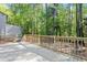 The wooden deck has a wooden railing and provides a large entertaining space at 2806 Shaftsbury St, Durham, NC 27704
