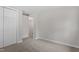 Bedroom with carpeting, white doors, and a view into the hallway at 2806 Shaftsbury St, Durham, NC 27704