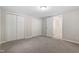 This bedroom has neutral paint and carpet, as well as two double-door closets for ample storage at 2806 Shaftsbury St, Durham, NC 27704