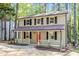 Charming two-story home featuring a welcoming front porch and vibrant red front door at 2806 Shaftsbury St, Durham, NC 27704