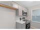 Updated kitchen with gray cabinetry, stainless steel appliances, and tiled backsplash at 2806 Shaftsbury St, Durham, NC 27704