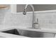Close-up of a modern kitchen sink with a stainless steel faucet at 2806 Shaftsbury St, Durham, NC 27704