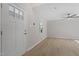 Open living room with wood-look floors, neutral walls, and a ceiling fan at 2806 Shaftsbury St, Durham, NC 27704