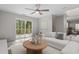 Cozy living room with outdoor deck access, modern décor, and comfortable white sofa at 2806 Shaftsbury St, Durham, NC 27704