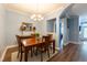 Formal dining room area with light fixture, wooden table, and decor at 2810 Bedford Green Dr # 207, Raleigh, NC 27604
