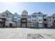 Attractive condo complex showcasing multiple units, each with a garage, and well-maintained grounds at 2810 Bedford Green Dr # 207, Raleigh, NC 27604