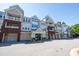Desirable condo building featuring garage parking, well-kept exterior, and inviting entrance at 2810 Bedford Green Dr # 207, Raleigh, NC 27604