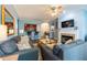 Cozy living room with a fireplace, open to the kitchen and dining area, perfect for relaxed living at 2810 Bedford Green Dr # 207, Raleigh, NC 27604