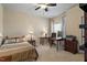 Bedroom with neutral walls, carpet, ceiling fan, desk, and window views at 3009 Weston Green Loop, Cary, NC 27513