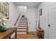 Entryway with hardwood floors, stairs, decorative furniture, and a light-filled ambiance at 3009 Weston Green Loop, Cary, NC 27513