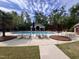 Inviting community pool surrounded by lounge chairs, mature trees, and blue sky at 3009 Weston Green Loop, Cary, NC 27513