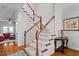 Elegant staircase featuring white railings, wood accents, and carpeted steps at 3009 Weston Green Loop, Cary, NC 27513