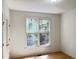 Bedroom with a window overlooking trees, and features a closet with double doors at 301 Charleston Ln, Chapel Hill, NC 27517