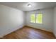 This simple bedroom has one window and bright white paint at 301 Charleston Ln, Chapel Hill, NC 27517