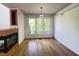 Bright dining room features wood floors, large windows, and a decorative light fixture at 301 Charleston Ln, Chapel Hill, NC 27517
