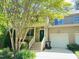 Charming townhome with a well-maintained front yard and a one car garage at 301 Charleston Ln, Chapel Hill, NC 27517