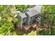Aerial view of a home with a backyard featuring a wooden deck and screened porch at 311 Arlington Rdg, Cary, NC 27513