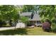 Traditional home with attached garage and lush landscaping at 311 Arlington Rdg, Cary, NC 27513
