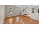 Open living space with hardwood floors and stairs to the upper level in neutral color palette at 311 Arlington Rdg, Cary, NC 27513