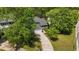 Aerial view of a beautiful home nestled among lush trees, offering privacy and serenity at 311 Arlington Ridge Rdg, Cary, NC 27513