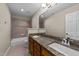 Bathroom featuring double vanity, tile flooring, and shower-tub combo at 311 Arlington Rdg, Cary, NC 27513