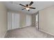 Spacious bedroom featuring carpet, ceiling fan, and closet at 311 Arlington Rdg, Cary, NC 27513