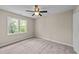 Neutral bedroom with a large window allowing for ample natural light at 311 Arlington Rdg, Cary, NC 27513