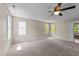 Large main bedroom featuring natural light, carpet, and ensuite bathroom at 311 Arlington Rdg, Cary, NC 27513