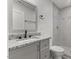 Bathroom featuring granite countertop and tiled shower at 326 W Gilbreath St, Graham, NC 27253