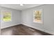 A bright bedroom with hardwood floors and natural light at 326 W Gilbreath St, Graham, NC 27253