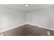 Bright bedroom with hardwood floors and minimalist design at 326 W Gilbreath St, Graham, NC 27253