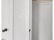A close-up view of an open closet with a wooden rail at 326 W Gilbreath St, Graham, NC 27253