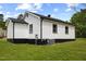 Exterior of a home with white siding and a green lawn at 326 W Gilbreath St, Graham, NC 27253