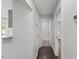 Hallway featuring dark hardwood floors and neutral paint at 326 W Gilbreath St, Graham, NC 27253