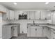 Modern kitchen with granite counters, stainless steel microwave, and ample cabinet space at 326 W Gilbreath St, Graham, NC 27253