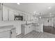Well-lit kitchen with granite counters, updated cabinets, and stainless appliances at 326 W Gilbreath St, Graham, NC 27253