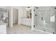 Bathroom featuring a glass shower, white marble style tile, and black hardware at 3297 Oakfields Rd # 1, New Hill, NC 27562