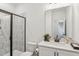 Bright bathroom featuring a glass enclosed shower, modern fixtures, and white quartz countertops at 3297 Oakfields Rd # 1, New Hill, NC 27562