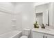 Bright bathroom with combination tub and shower with white vanity at 3297 Oakfields Rd # 1, New Hill, NC 27562