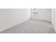 Carpeted bedroom features neutral decor and a window with a view at 3297 Oakfields Rd # 1, New Hill, NC 27562