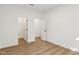 Empty bedroom with a walk-in closet and hardwood floors at 3297 Oakfields Rd # 1, New Hill, NC 27562