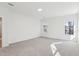 Bedroom with carpet and two windows at 3297 Oakfields Rd # 1, New Hill, NC 27562